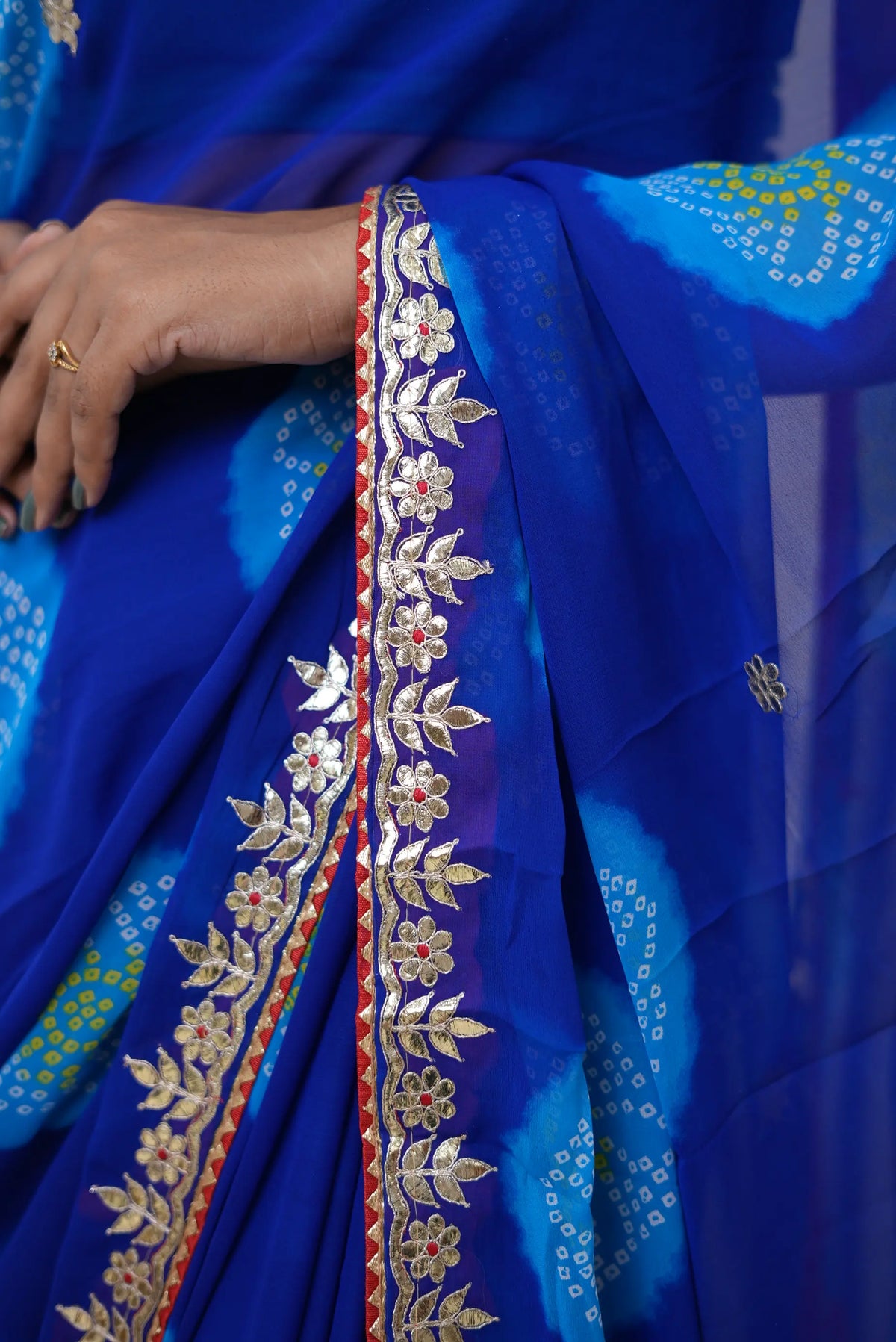 Blue Bandhani Print Saree with Gota Patti and Lace Border Work by Odhani by SRN