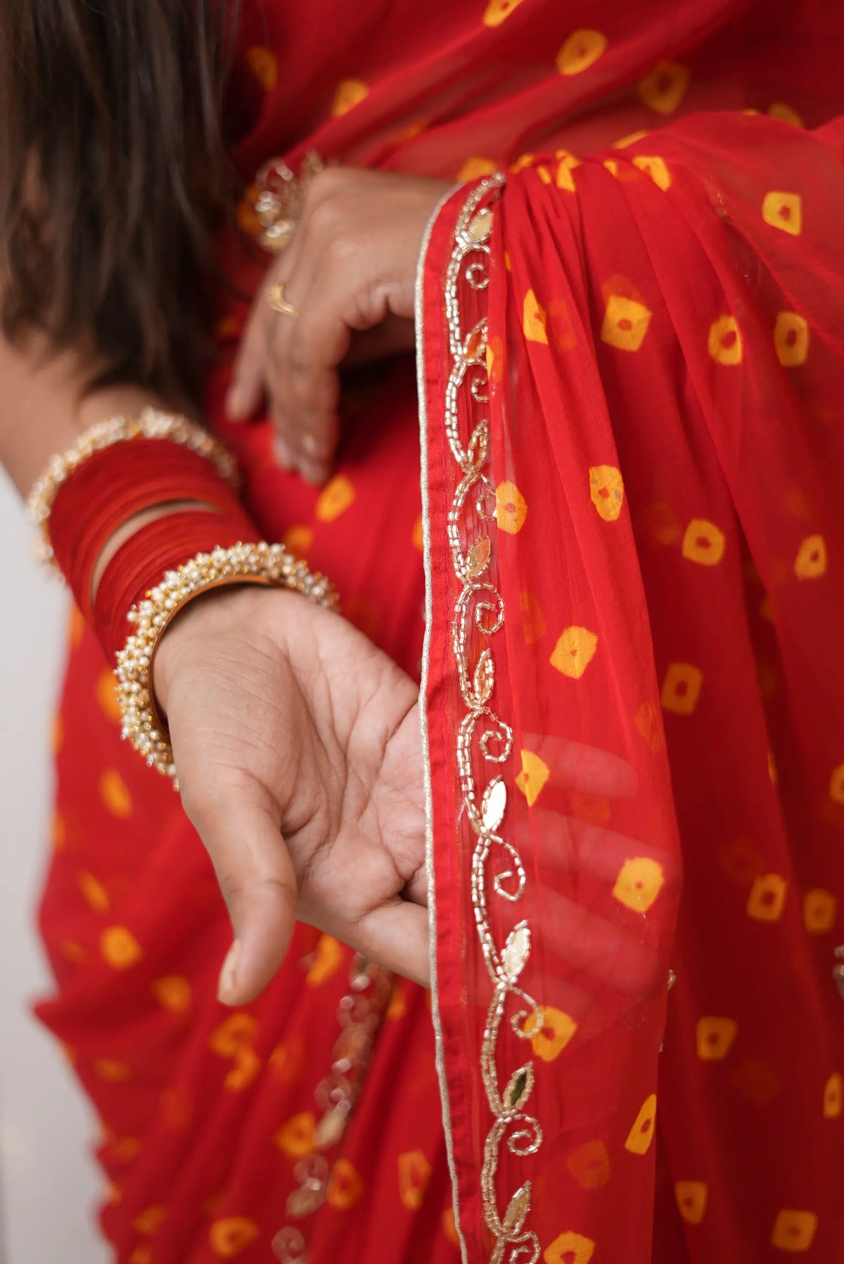 Red Traditional Bandhani Saree with Cut Dana Zari Border Work by Odhani by SRN
