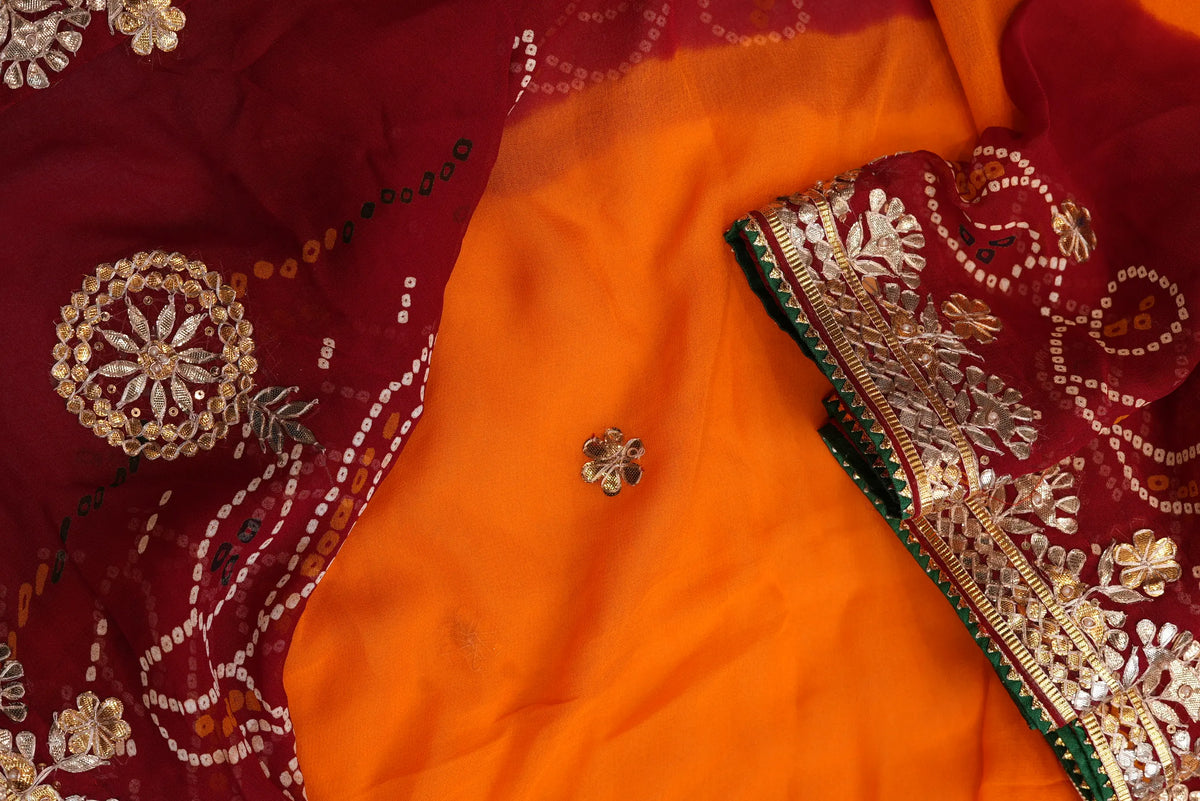 Close-up of bright saffron yellow center body with handcrafted Gota flower motif and circular chakra Bandhej pattern