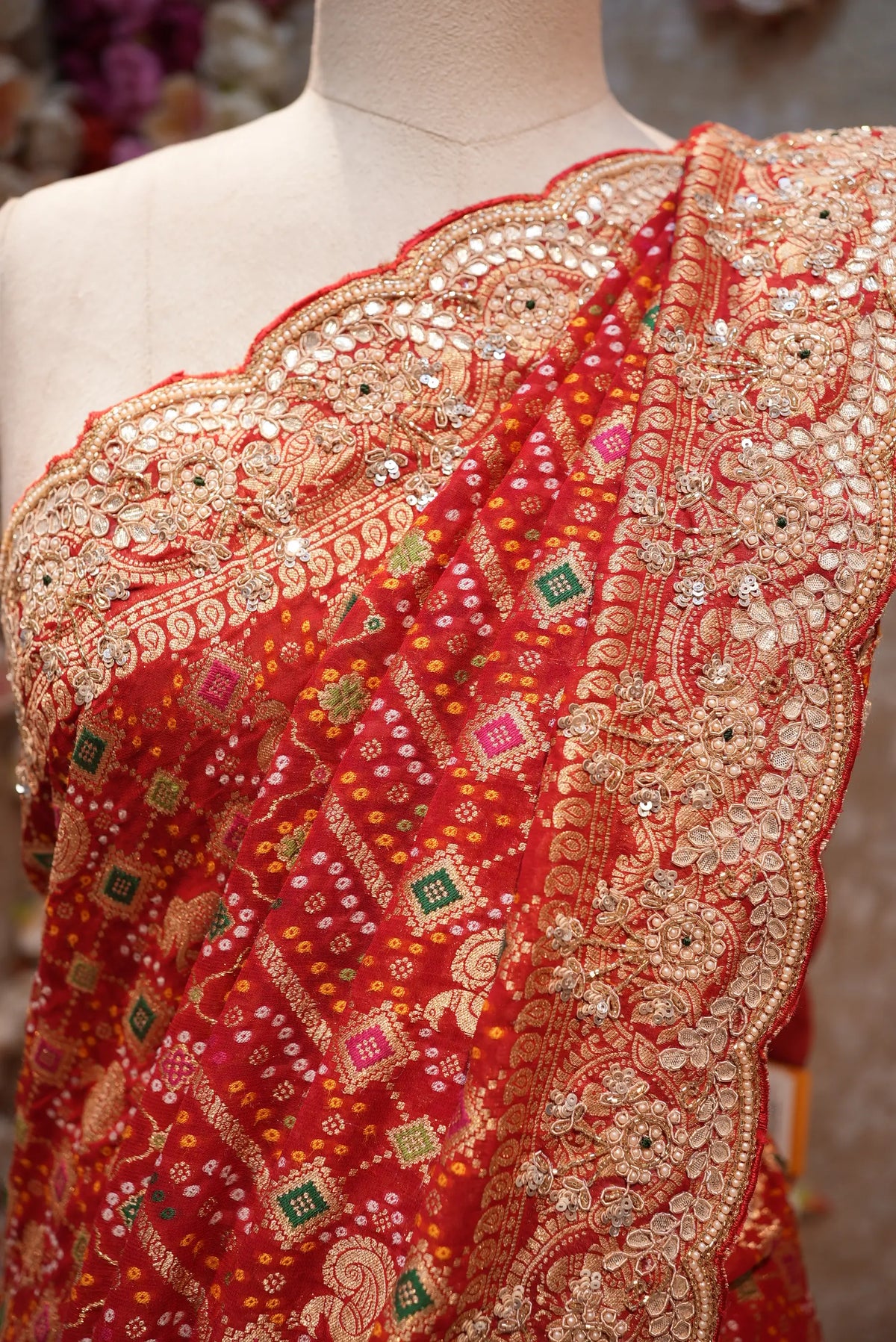 Detailed close-up view of scalloped border featuring zardozi, sequin, cut dana, and gota patti needlework