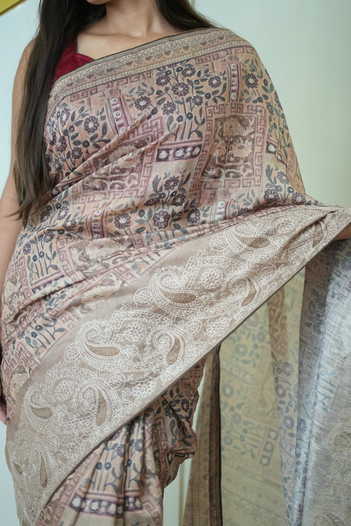 Torso drape shot showing floral-geometric block print and embroidered pallu border