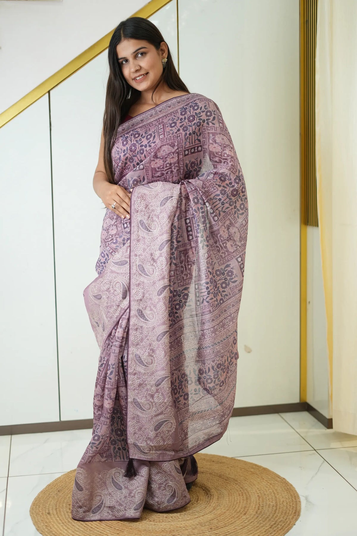 Model draped in mauve-purple mix cotton block print saree with embroidered paisley border