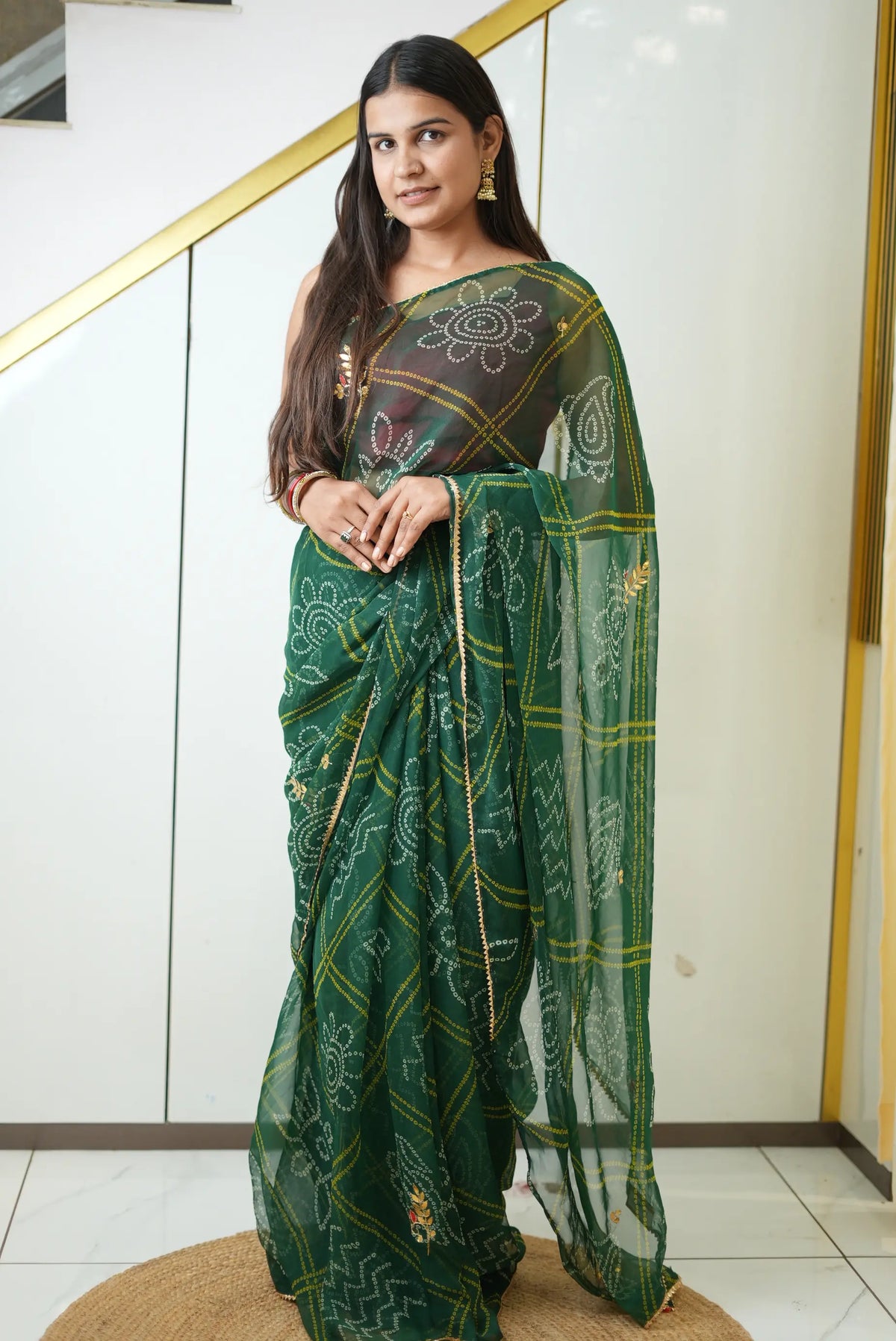 Full length view of deep emerald green chiffon bandhani saree with gota patti butta work