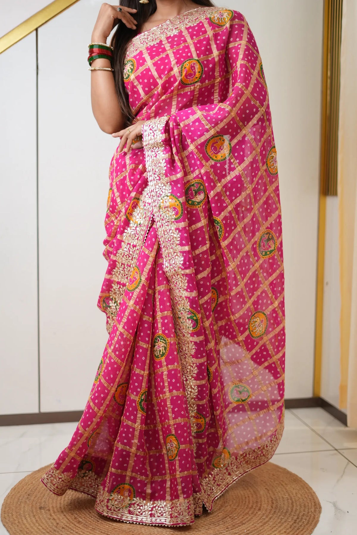Full length drape of rani pink pure gajji silk bandhani saree with heavy gota patti border