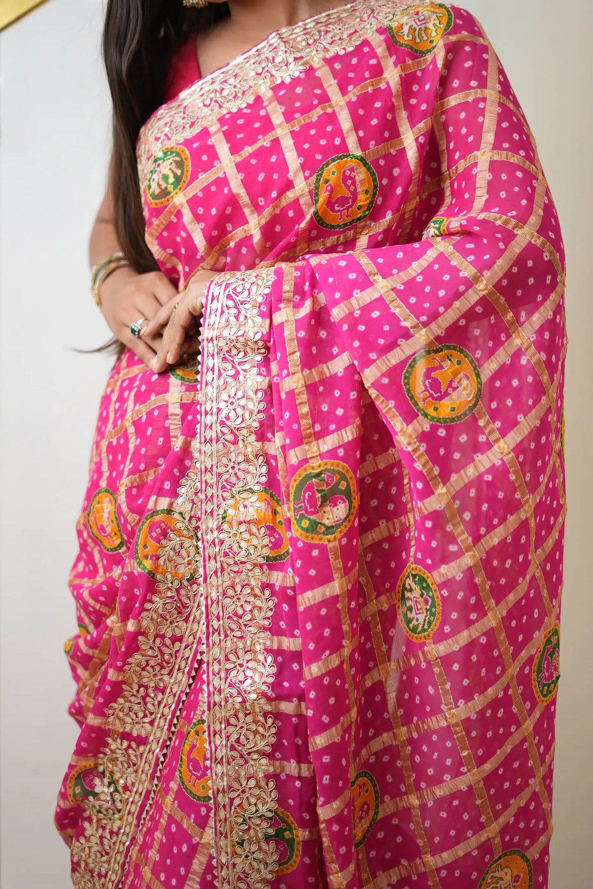 Rani pink gajji silk bandhani saree with traditional elephant and peacock circular motifs