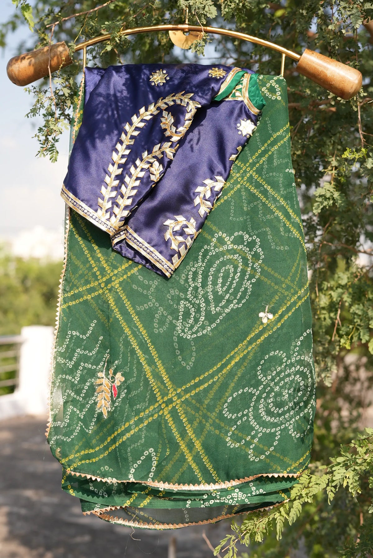 Folded Tannu royal blue silk Aangi blouse with handworked gold gota patti leaf border