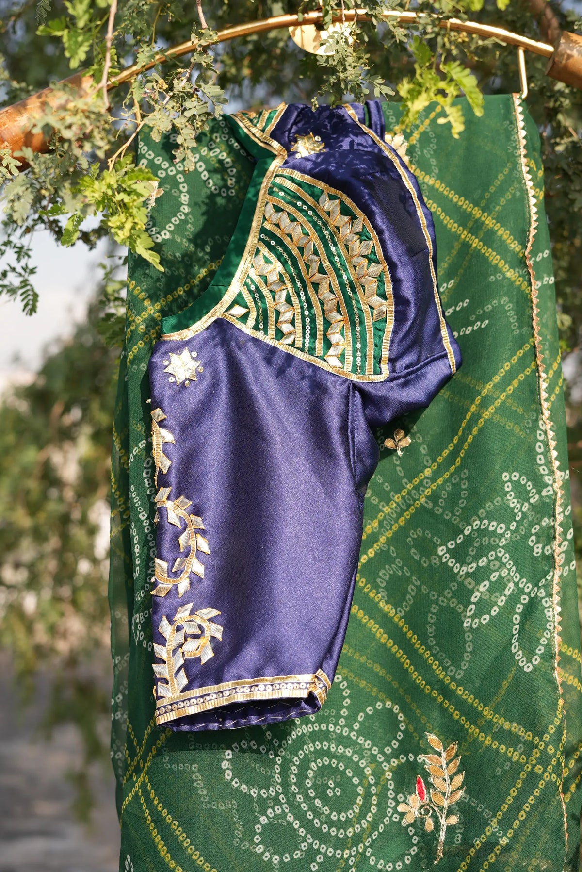 Side view of Tannu royal blue silk Aangi blouse showing intricate sleeve and back neck gota patti work