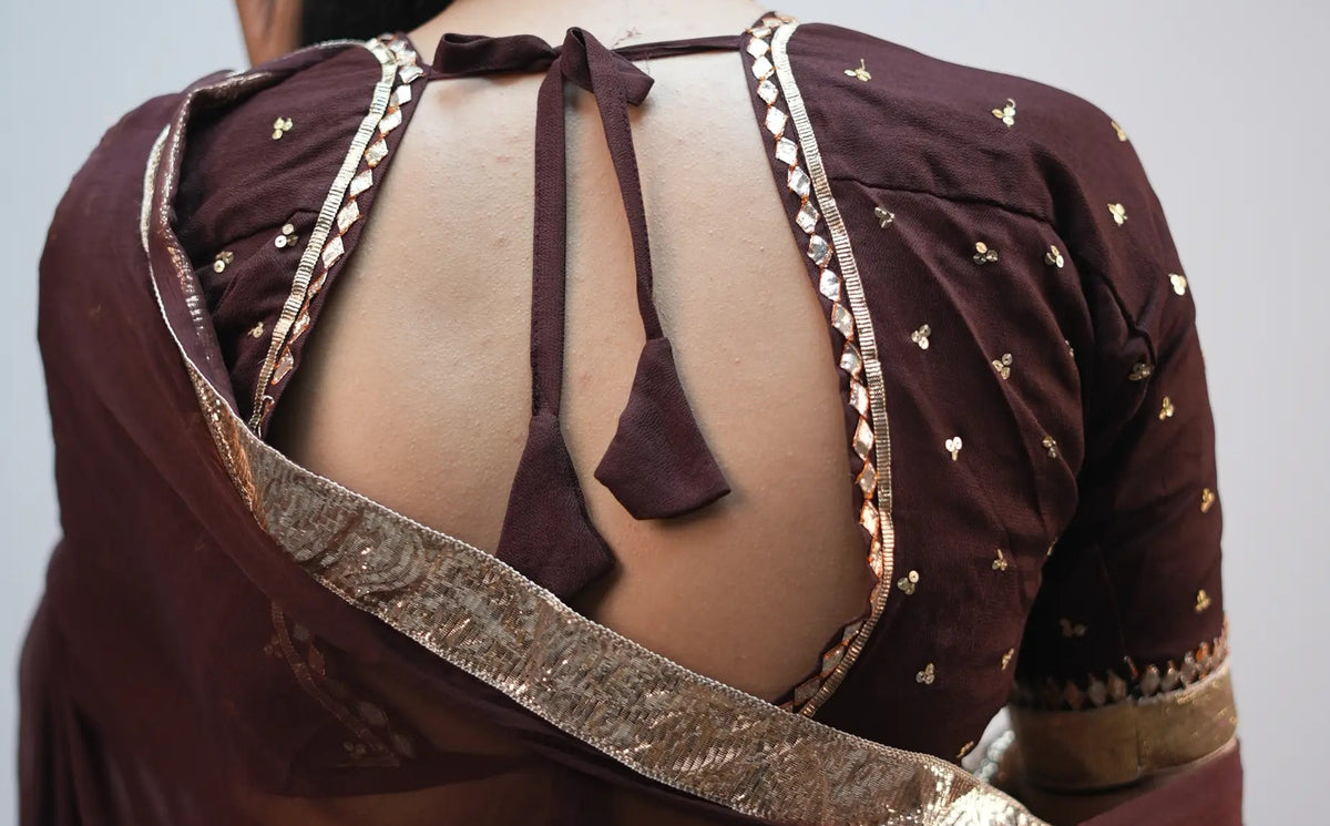 Back view of Shakti Aangi Blouse featuring open back design with tie up dori tassels
