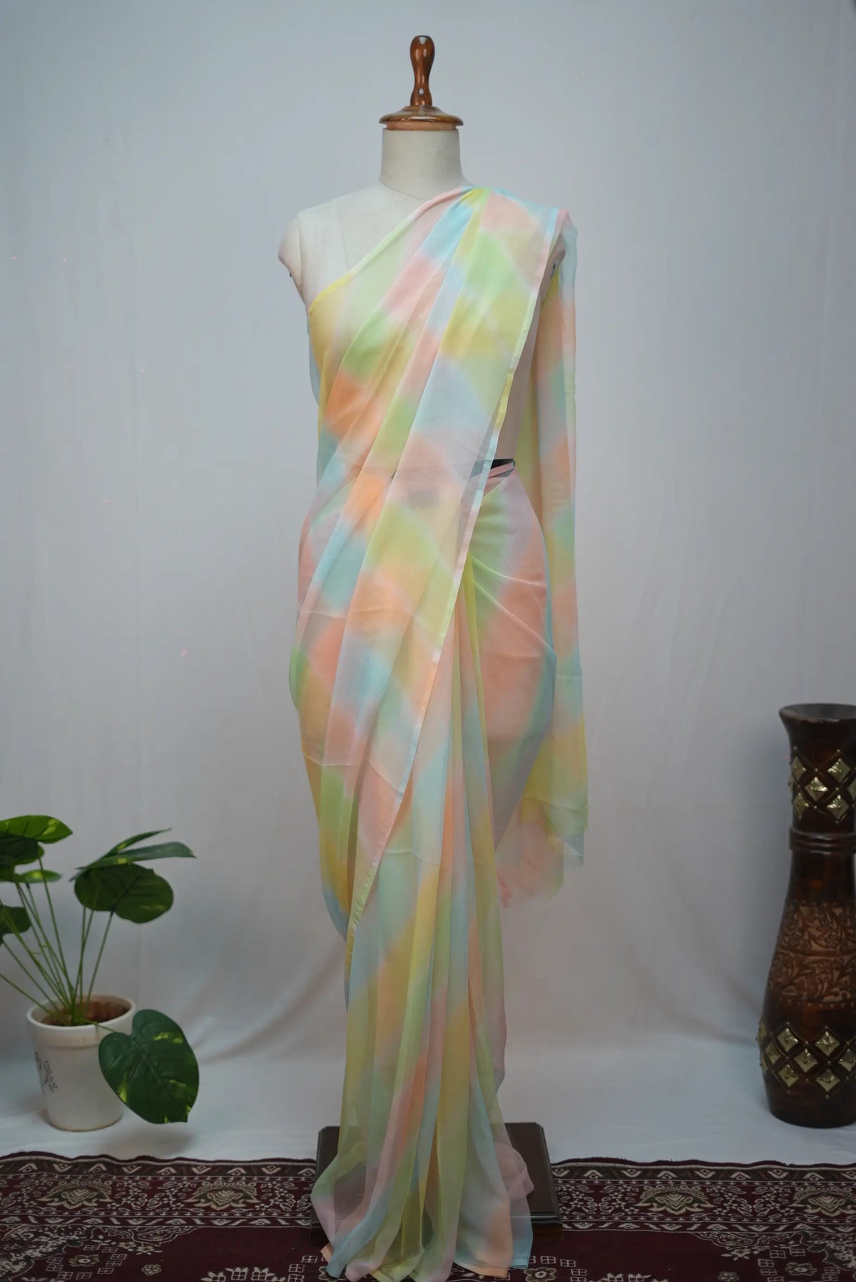 Front mannequin draping view of pastel yellow blue pink samundar leheriya georgette saree
