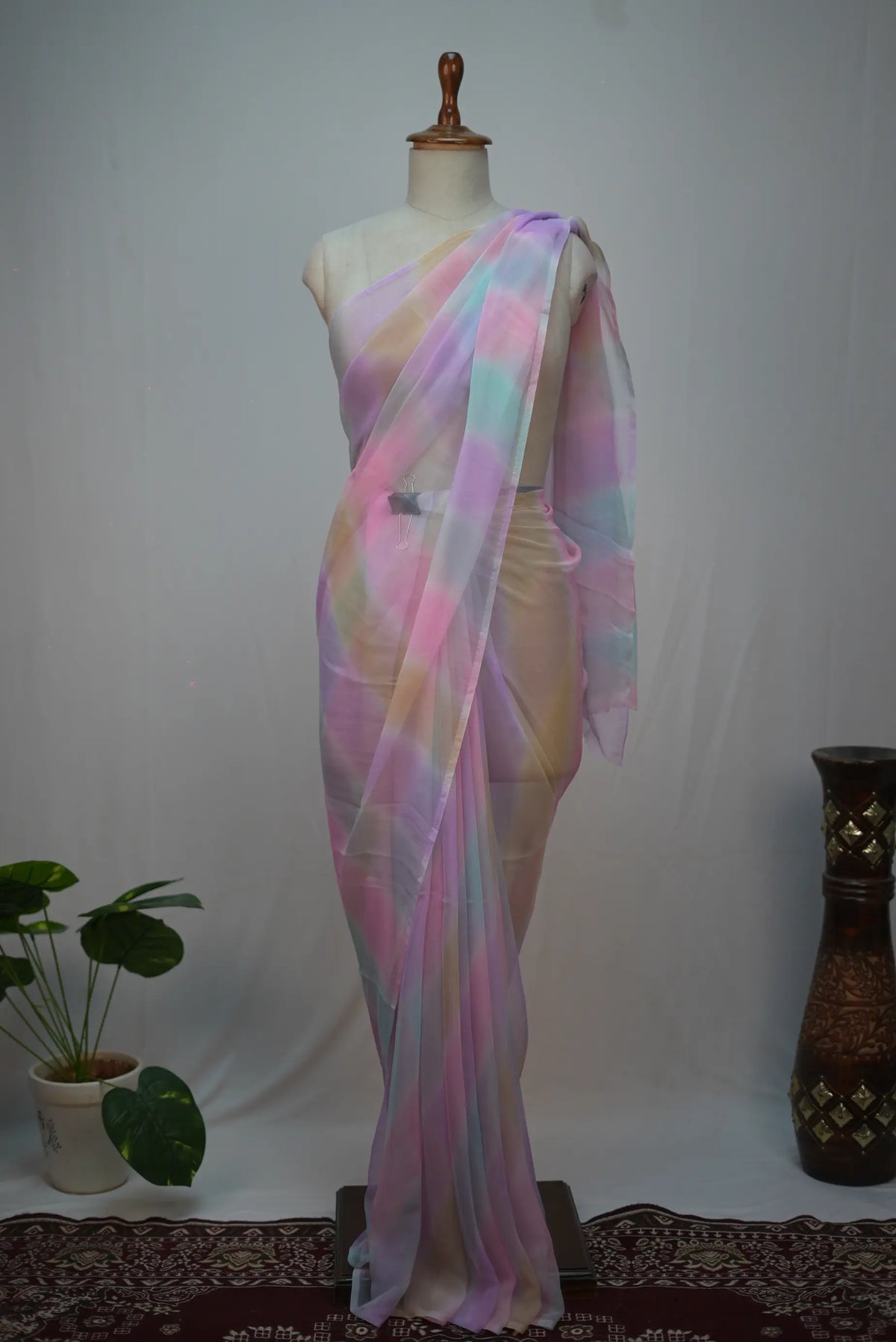Mannequin display of pastel multicolor rajasthani samundar leheriya georgette saree showing pink and blue wave patterns