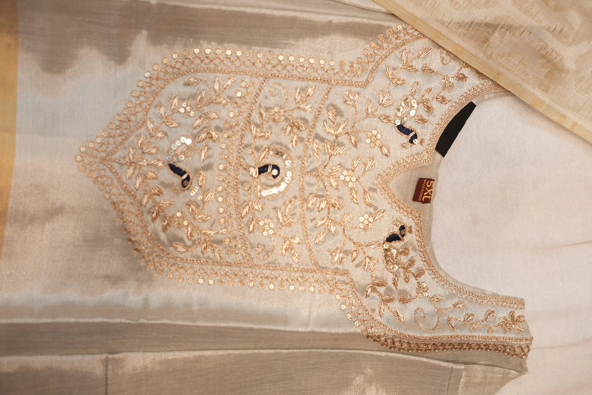 Detailed close up of handcrafted zardosi and sequin embroidery on kurti neckline