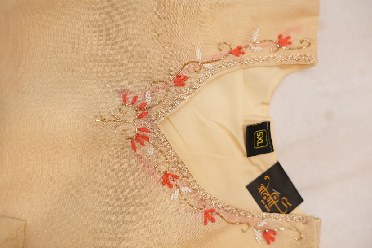 Close up view of V neck with cut dana moti and zardosi embroidery on light golden kurti