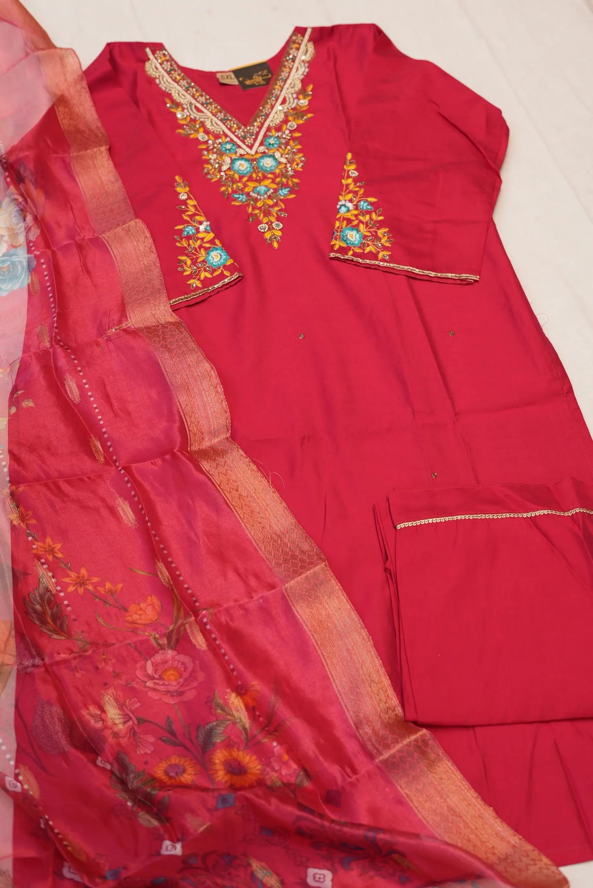 Full flat lay view of 3 piece rani pink uppada silk suit set with pants and organza dupatta in size 5XL