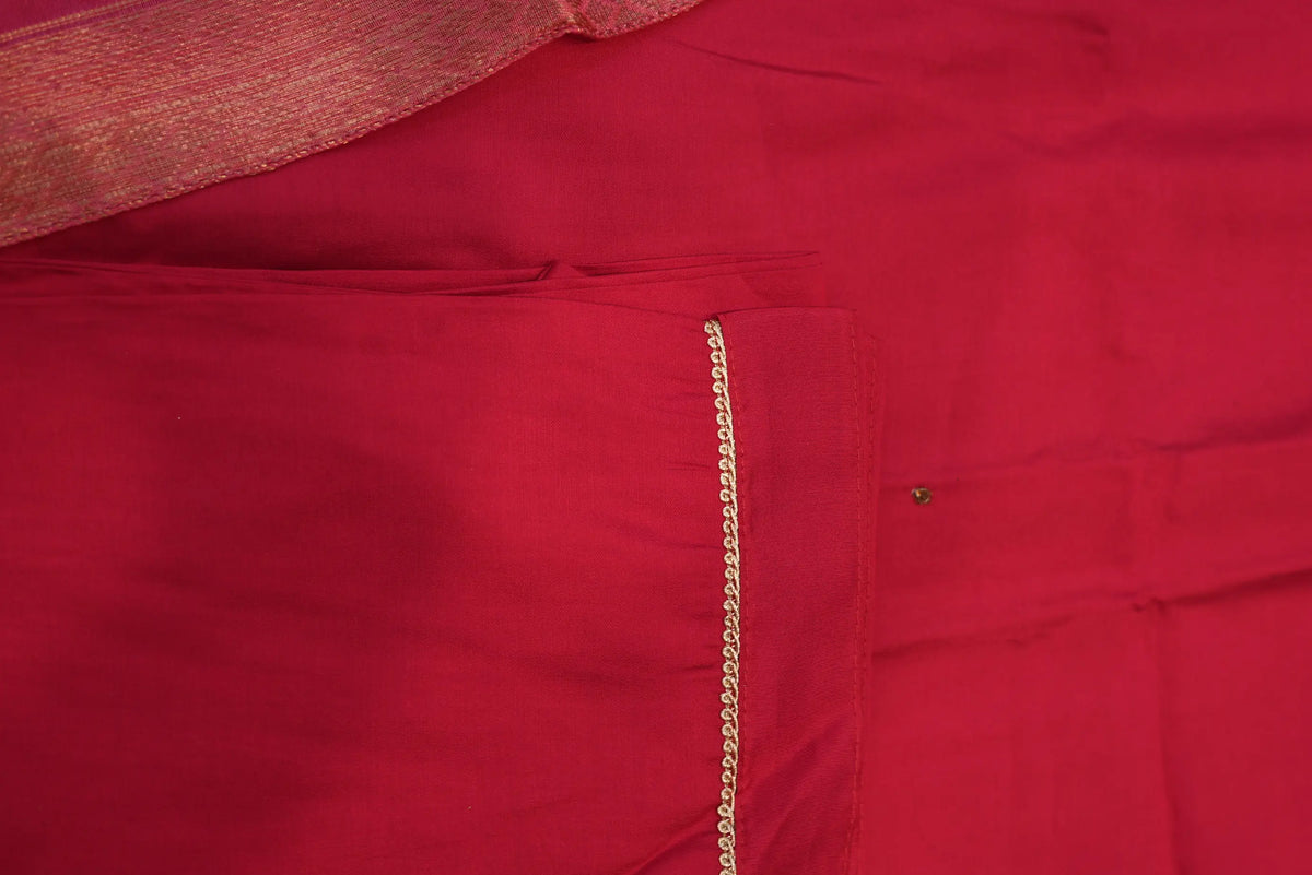 Close up of rani pink straight pant hem with fine lace trim border