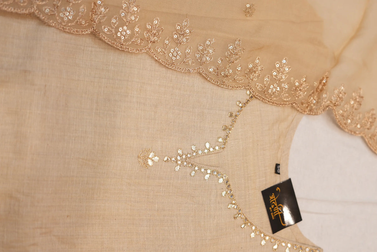 Close up view of round neck with V-cut on beige khadi kurta embellished with gold gotta patti work