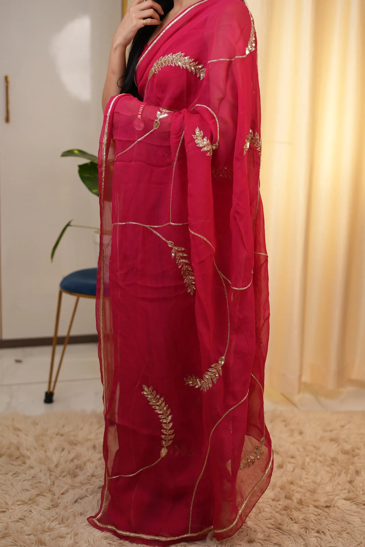 Side profile shot highlighting the transparent texture and elegant shine of pure organza saree