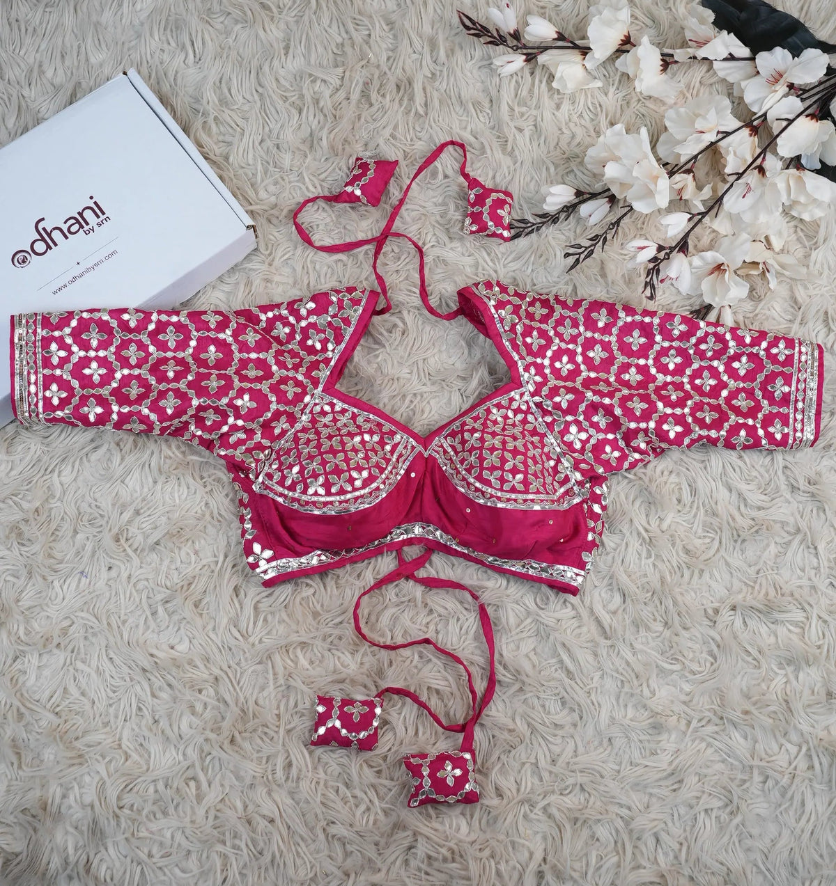 Full flat lay view of customized rani pink Gota Patti Aangi blouse displayed alongside Odhani brand box