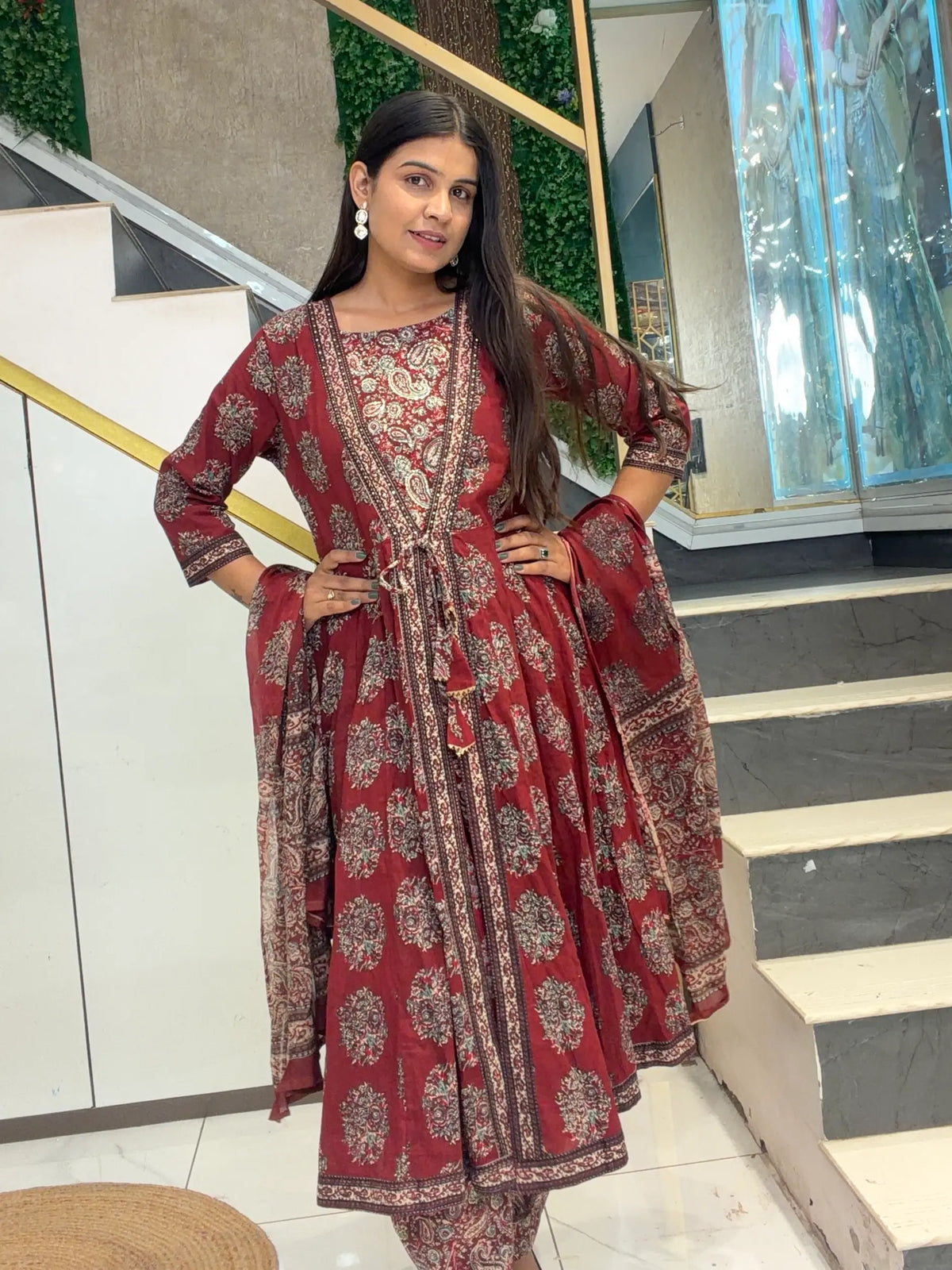 Full-length model pose in Maroon Pure Cotton Kalamkari Print Flared Anarkali 3-Piece Suit Set