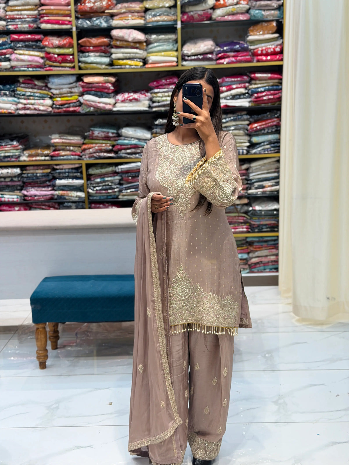 Front view of model wearing Pyaji color Pakistani 3-piece suit with Farshi salwar and heavy Zari neck work