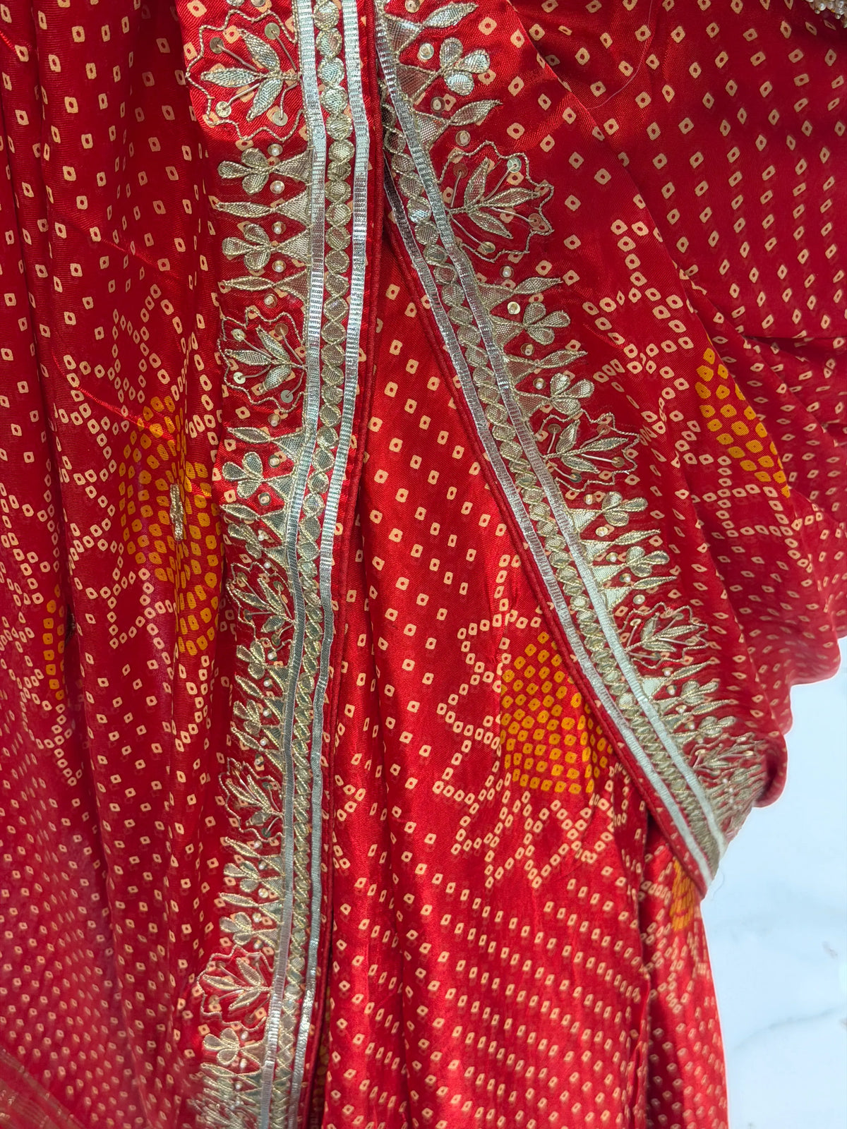 Close-up of Heavy Floral Gota Patti Hand Embroidery on Red Gajji Bandhani Saree