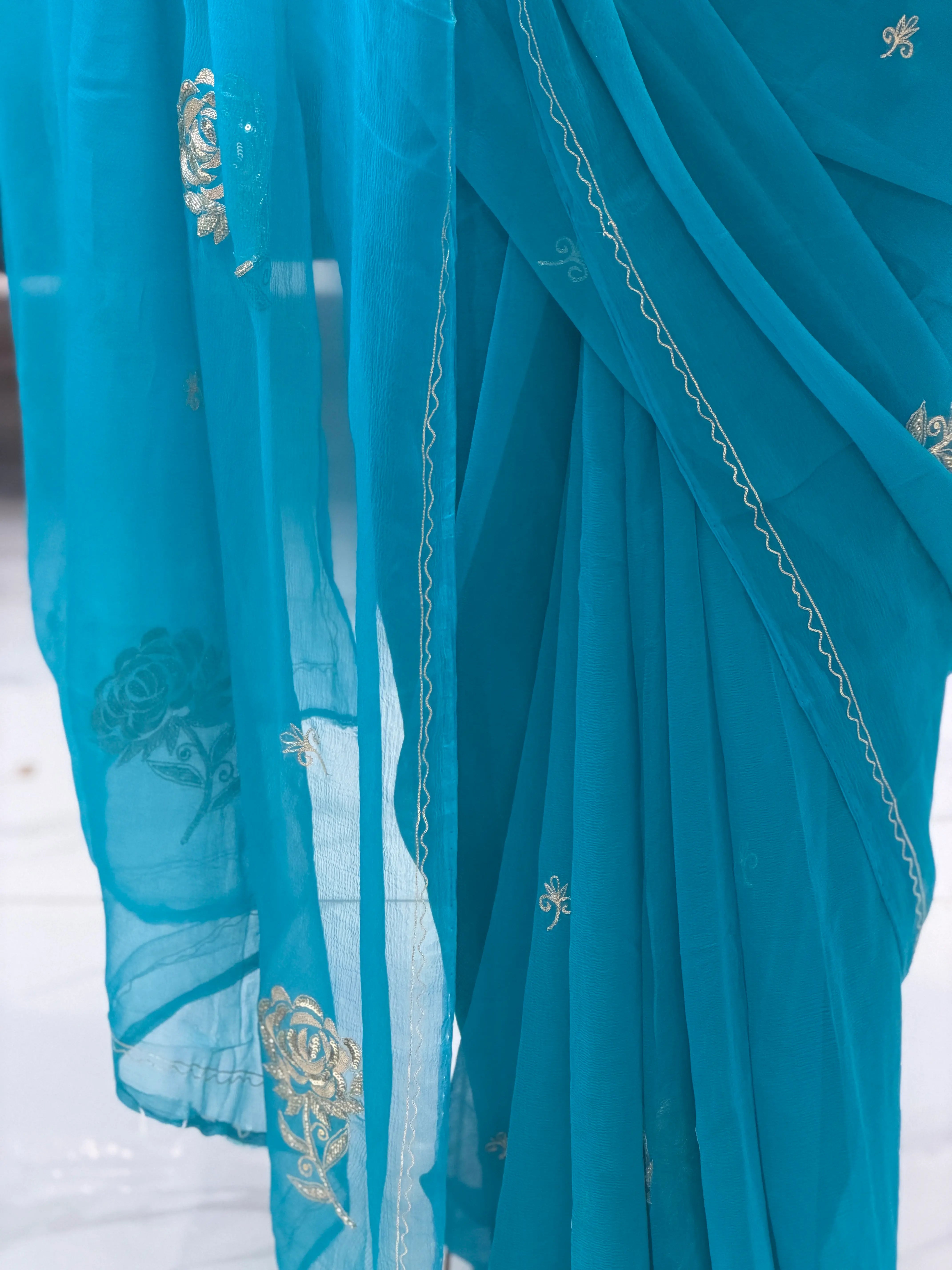 Pleats and Fine Zigzag Embroidery Border on Peacock Blue Chiffon Saree