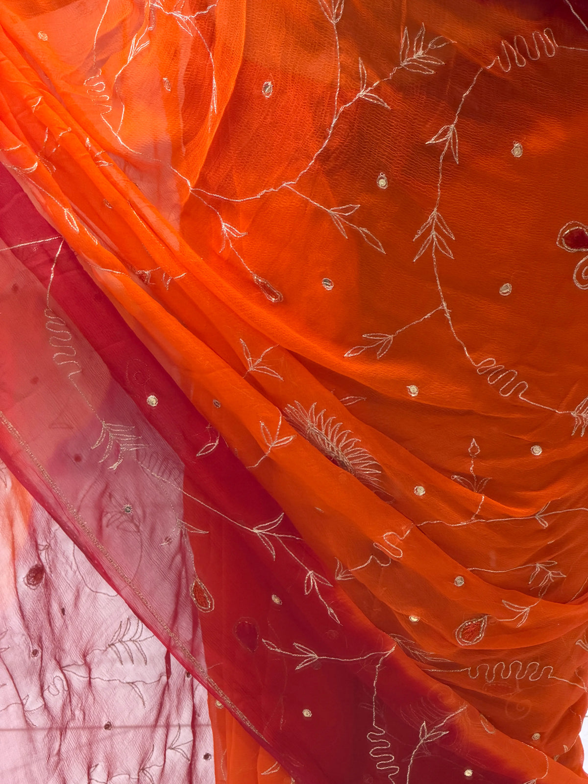 Detail View of Fine Hand Embroidery Threadwork and Sequence Highlights on Chiffon Fabric