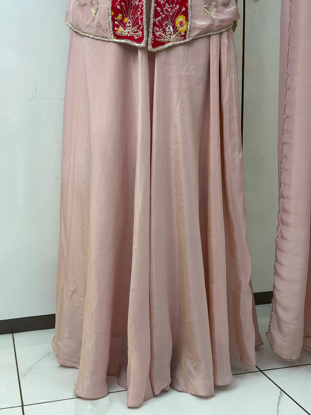 Full flared light pink long skirt flare detail with short kurti hem